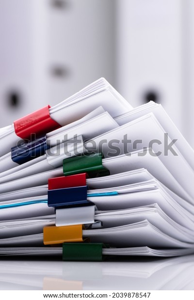 Accounting Tax Files At Clerk Office.\
Financial Contracts And\
Paperclips