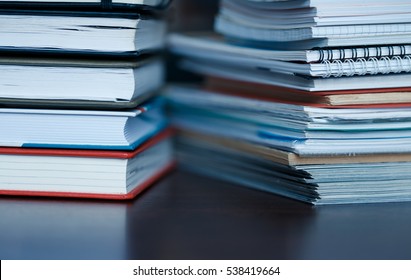 Accounting And Taxes. Large Pile Of Magazine, Notebook And Books Closeup