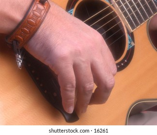 Accoustic Guitar and hand