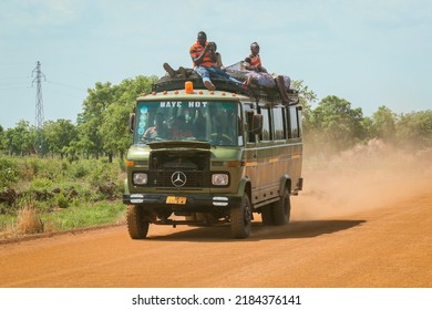 Accra, Ghana - April 01, 2022: Crowded African Public Bus On The Dusty Road In The Heart Of Ghana