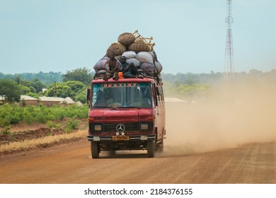 Accra, Ghana - April 01, 2022: Crowded African Public Bus On The Dusty Road In The Heart Of Ghana