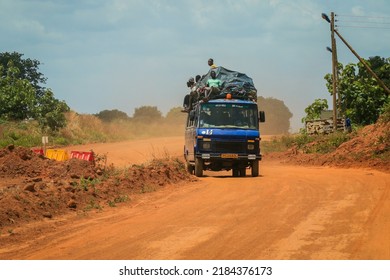 Accra, Ghana - April 01, 2022: Crowded African Public Bus On The Dusty Road In The Heart Of Ghana