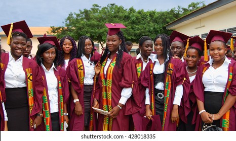 Accra. Ghana -July 27,2013: Smiling happy African school girls & boys in their high school graduation day in Accra. Education in West African countries. Portrait of group of graduates. Study in Ghana