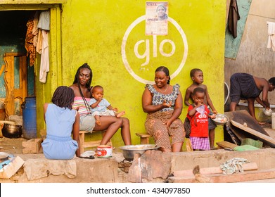 ACCRA, GHANA - MARCH 3, 2012: Unidentified Ghanaian women and their children discuss something in Ghana. People of Ghana suffer of poverty due to the unstable economic situation
