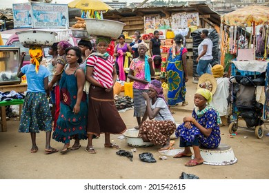 ACCRA, GHANA - MARCH 4, 2012: Unidentified Ghanaian people at the market in Ghana. People of Ghana suffer of poverty due to the unstable economic situation