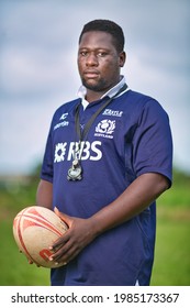 ACCRA,GHANA- JUNE 4, 2017: Portrait Photo Of The Conquerors Rugby Team Coach In Ghana Holding A Ball. 