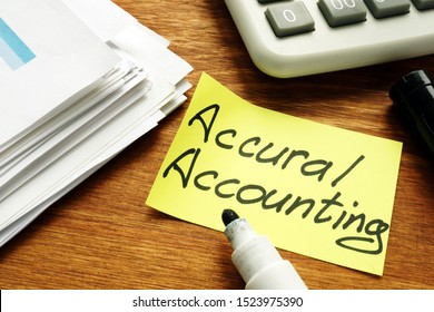 Accrual Accounting concept. Business report and calculator.