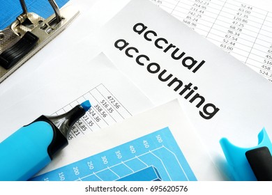 Accrual accounting document on a table.