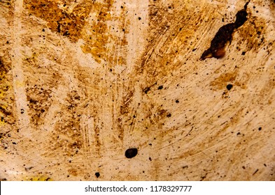 Accumulated Dirt, Grime, Grease, And Stains On The Base Of A Steel Cooking Pan.