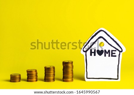 Accumulating money for your home on a yellow background