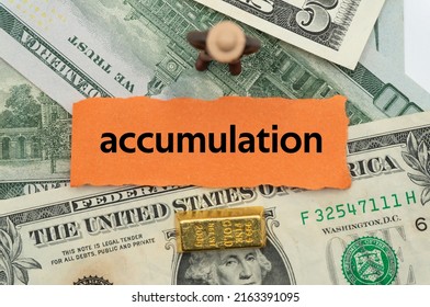 accumulation.The word is written on a slip of paper,on colored background. professional terms of finance, business words, economic phrases. concept of economy. - Shutterstock ID 2163391095
