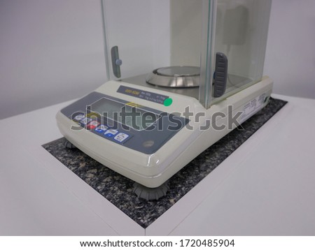 accurate laboratory weighing scale on the table
