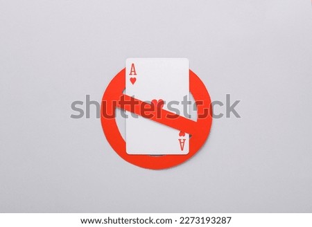 Ace of hearts with a prohibition sign on gray background. Gambling ban