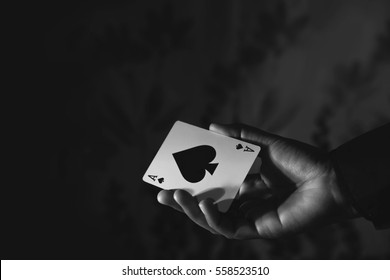 Ace Spade Card in Hand, Low-key lighting