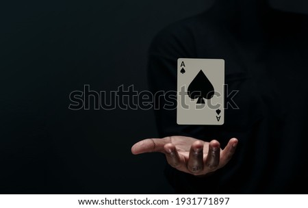 Ace Spade Playing Card. Levitating Poker Card on Hand. Front View. Closeup and Dark Tone