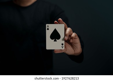 Ace Spade Playing Card. Person Holding a Poker Card. Front View. Closeup and Dark Tone - Shutterstock ID 1927628213