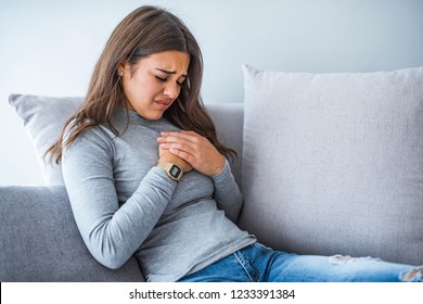 Aches And Pains Concept. Sick Woman Having Bad Ache And Pain Heart Attack Health Problem. Female Placing Hands On Her Chest. Woman Is Clutching Her Chest, Acute Pain Possible Heart Attack