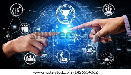 Achievement and Business Goal Success Concept - Creative business people with icon graphic interface showing employee reward giving for business success acheivement.