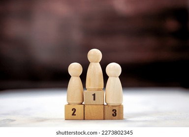 Achievement concept. Wooden podium 1, 2, 3, human standing on podium with ranking winner business and sport competition concept copy space space for text - Shutterstock ID 2273802345