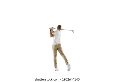 Achievement. Golf player in a white shirt taking a swing isolated on white studio background with copyspace. Professional player practicing with bright emotions and facial expression. Sport concept.