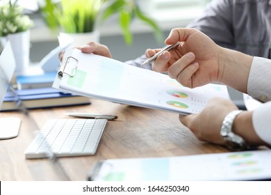 Achievement project goal, implementation scope. Men discuss report on product improvement or cost reduction. Incentive system encourages managers to think about profitability growth opportunities. - Shutterstock ID 1646250340