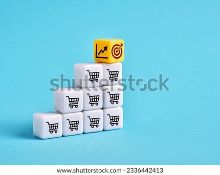 Achieving the sales goals and business growth. Setting the sales target objectives. Shopping cart, target and ascending graph symbols on cubes.