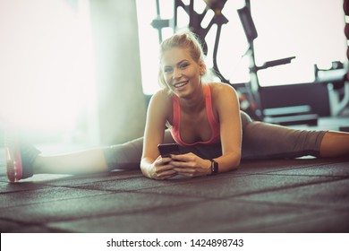  Achieving Those Fitness Goals Are Just An Ap. Woman At Gym Using Phone.