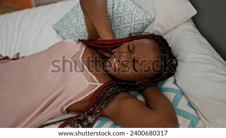 Aching neck saga, african american woman lying on bed in pain, struggling with cervical discomfort in her cozy bedroom