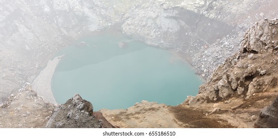 Acid Lake In The Crater Of The Gorely Volcano On A Foggy Day. Siberia, Kamchatka, Russia 