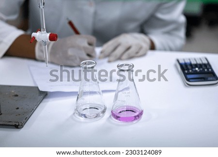Acid-base reaction titration in Laboratory.