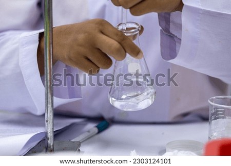 Acid-base reaction titration in Laboratory.