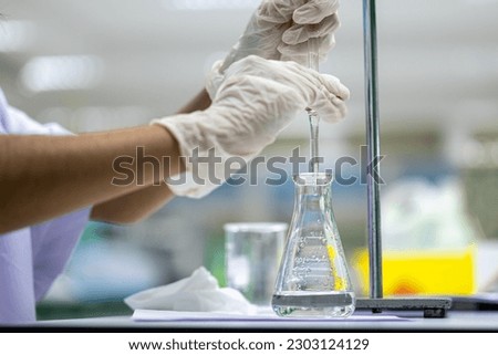 Acid-base reaction titration in Laboratory.