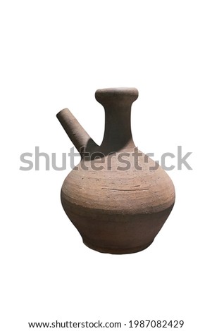 Acient Kendi isolated on white background. Stoneware pottery jar for drinking.