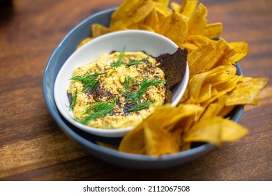 Ackee made into a dip served with plantain chips. Dip and chips
