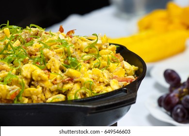 Ackee and Salt fish Breakfast served with assorted fruits and fried bammies