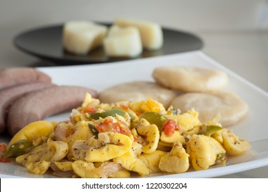 Ackee and Salt Fish served with boiled bananas and dumplings