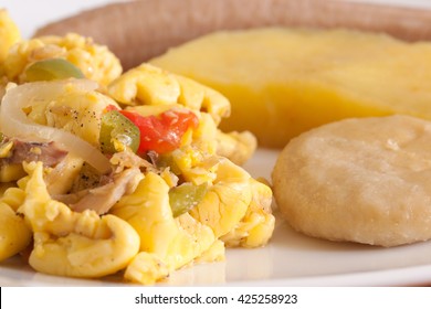 Ackee and Salt Fish served with boiled dumplings, yams and bananas. 