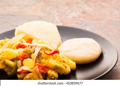 Ackee and Salt fish served with boiled dumplings and yams. 
