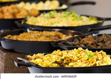 Ackee and Salt fish served with Braised Liver, Yellow Yam Hash, Fried Dumplings and Baked Bammies