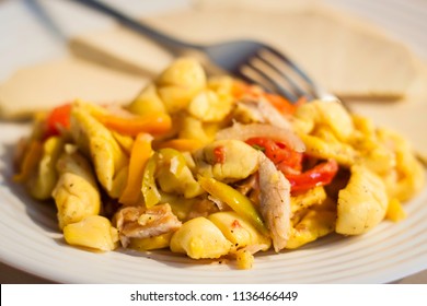 Ackee and Salt-Fish close up on a white plate