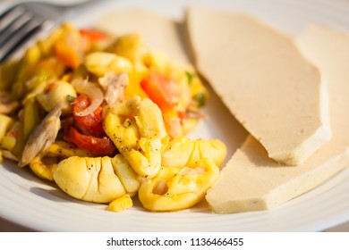 Ackee and Salt-Fish close up on a white plate