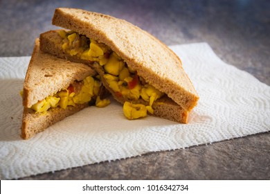 Ackee and Salt-fish sandwich made with whole wheat bread