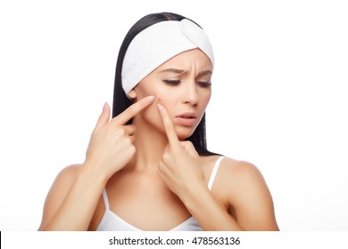 Acne treatment. Acne woman. Young woman squeezing her pimple, removing pimple from her face. Woman skin care concept. Acne spot pimple spot skincare beauty care girl pressing on skin problem face.