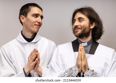 The Acolyte And The Clergyman Look At Themselves.