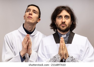 The Acolyte And The Clergyman Pray Together.