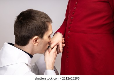 The Acolyte Kisses The Ring Of His Superior.