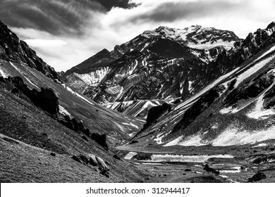 Aconcagua Peak. Aconcagua is the highest mountain in America and the Western and Southern Hemispheres at 6,960.8 metres. It is located in the Andes mountain range, in Mendoza, Argentina.