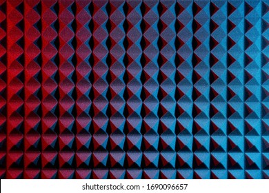 Acoustic foam panel background with red and blue lighting. Music background