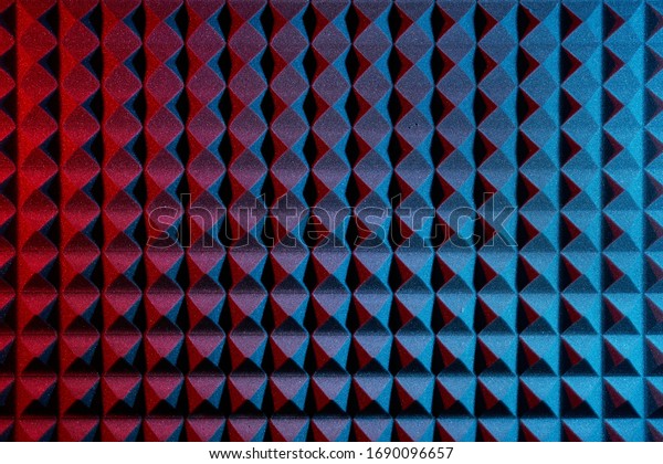 Acoustic foam panel background with red and\
blue lighting. Music\
background