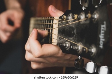 Acoustic Guitar being Played by man